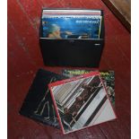 A carry case of L.P records to include T Rex, The Beatles, Jimi Hendrix etc.