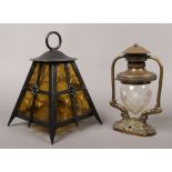 An ornate brass wall mount ships lantern with cut glass dome shade, along with a amber glass wrought