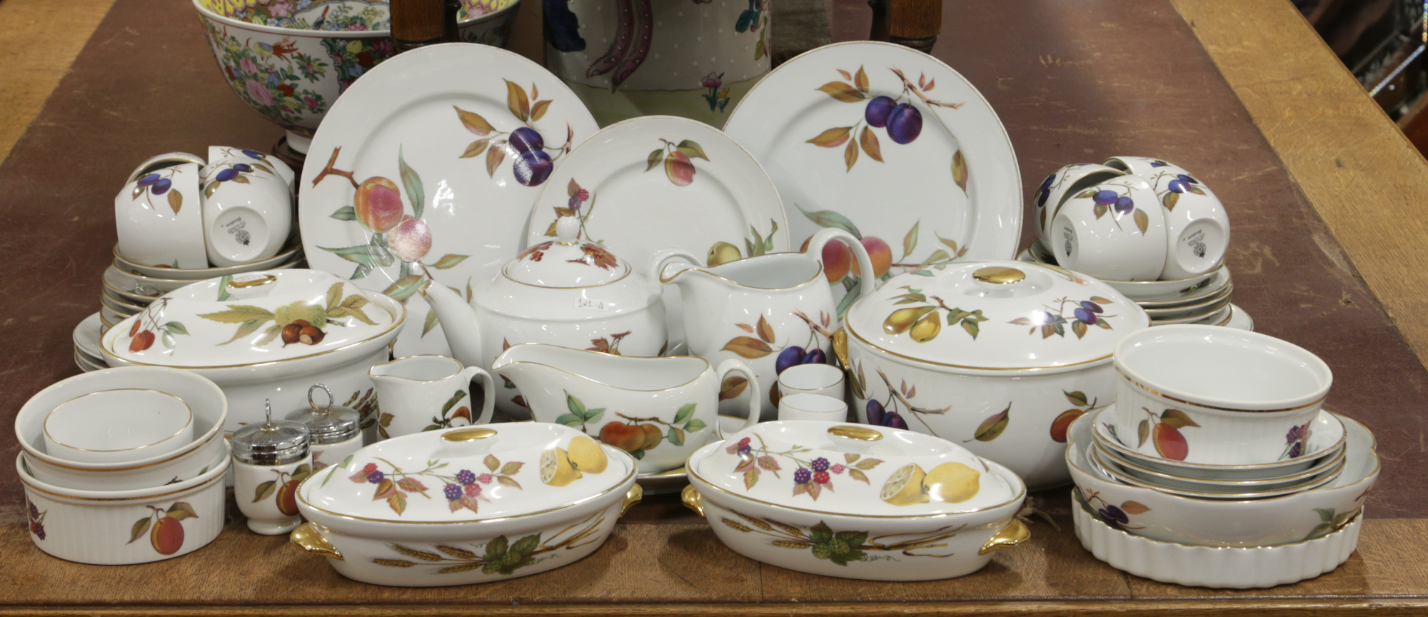 A large quantity of Royal Worcester 'Evesham' tea and dinnerwares including cups and saucers,