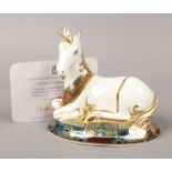 A Royal Crown Derby unicorn paperweight designed to celebrate The New Millennium with gold stopper.