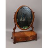 A mahogany toilet mirror with two drawer base,m label for George Tannahill & Sons to drawer.