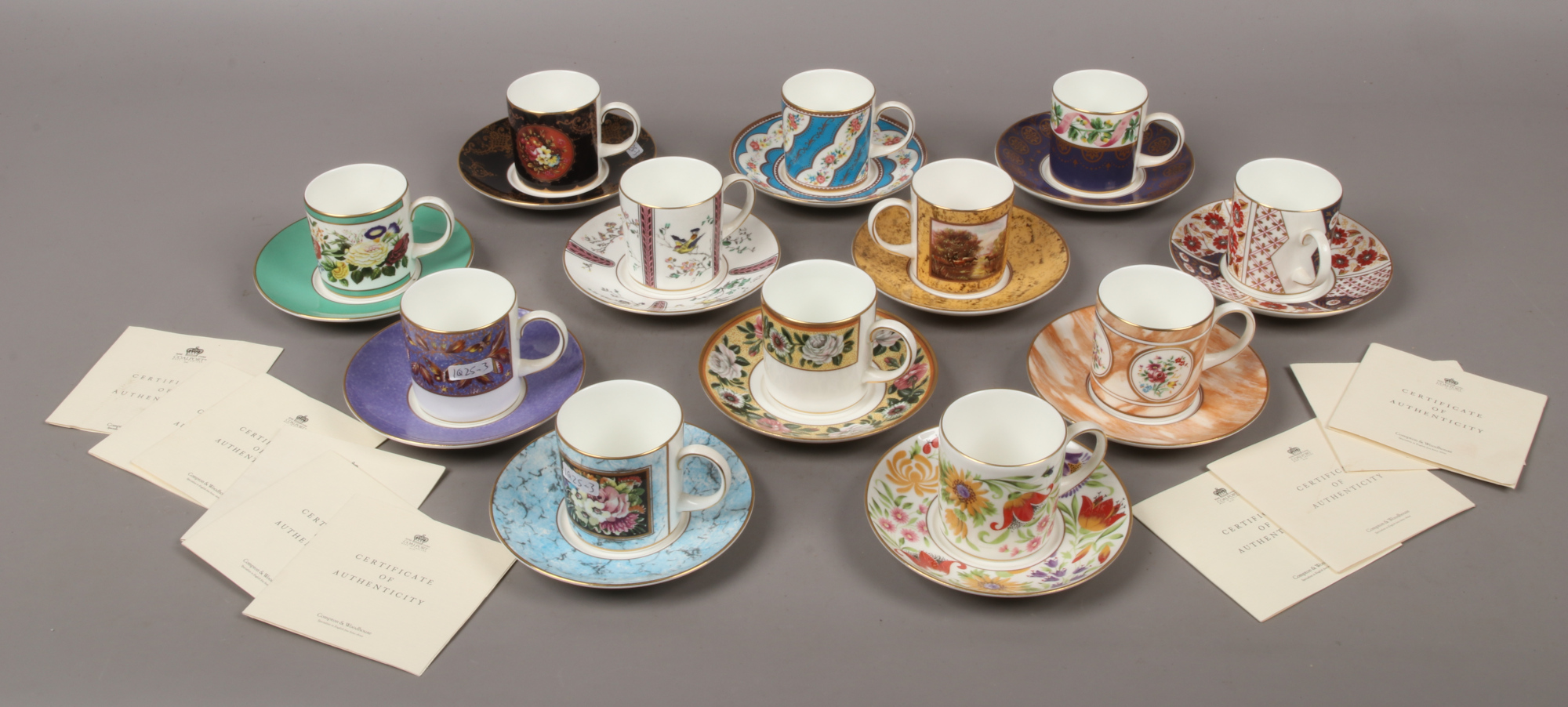 A set of twelve Coalport 'The Coalport Museum Historic Coffee Cup Collection' bone china cups and