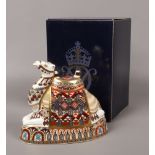 A large Royal Crown Derby paperweight, camel with gold stopper.