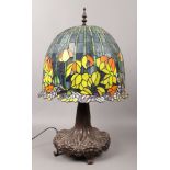 A large Tiffany style table lamp with bronzed base, height 76cm.