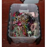 A large box of costume jewellery to include necklaces, beads, bangles etc.