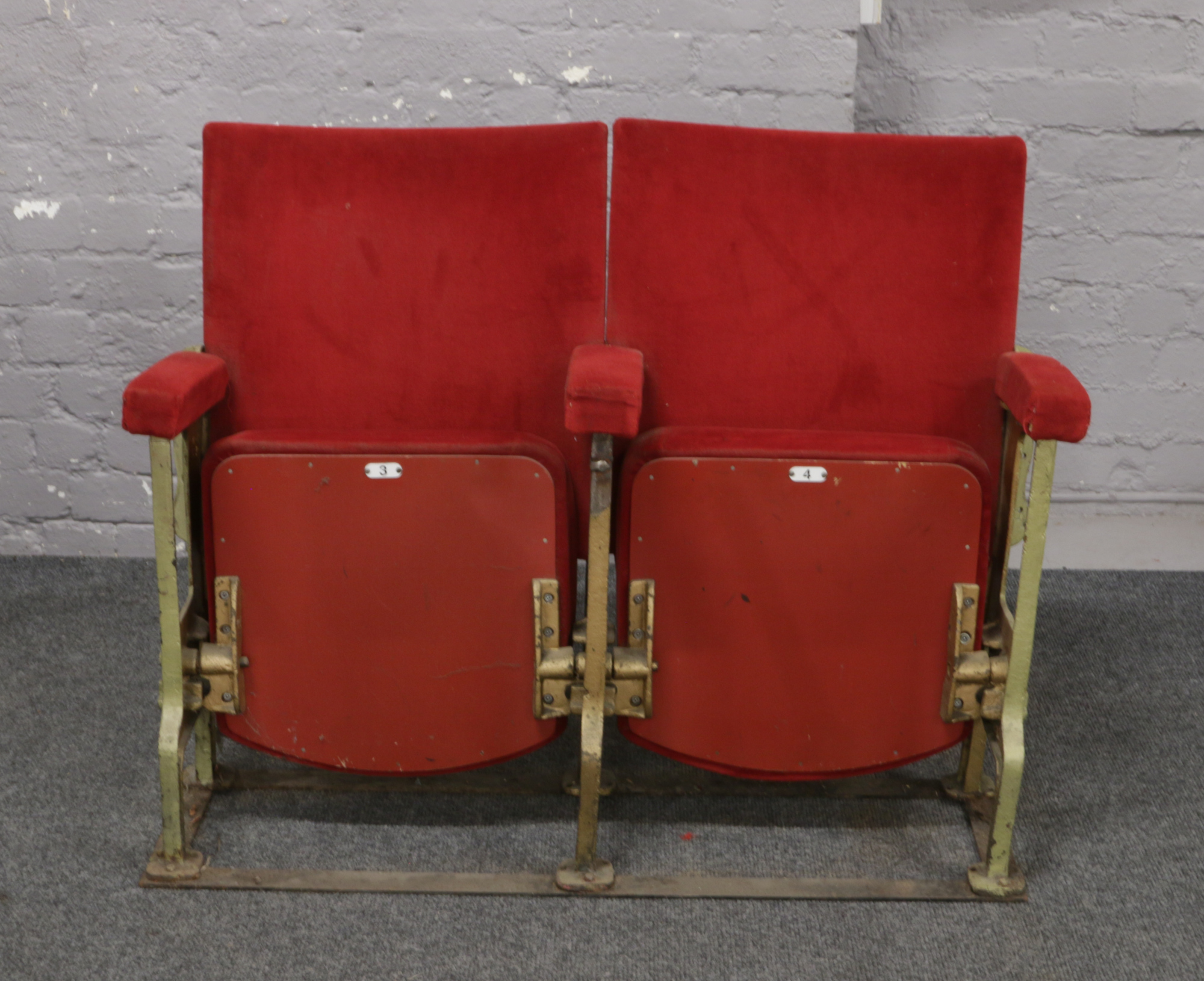 A pair of folding theatre / cinema seats.