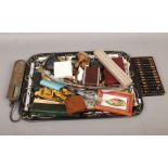 A tray of collectables to include Salter spring balance, postcards, hand fans etc.