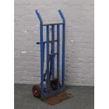 A metal framed heavy duty sack barrow.