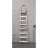 A pair of aluminium 7 rung step ladders.