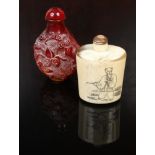 Two Chinese snuff bottles one bone with pen work figural decoration, along with a carved amber