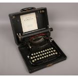 A vintage cased folding typewriter by L.C.Smith & Corona typewriters including USA with original