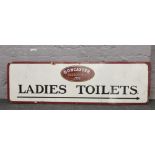 A painted wooden sign from Doncaster Racecourse 'Ladies Toilets'.