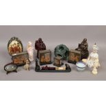 A collection of oriental themed items to include cork carvings, hardstone puzzle ball, tea bowl