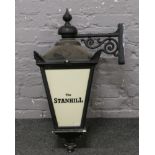 A wall mounting metal pub lantern advertising The Stanhill.