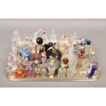 A tray of scent bottles to include ornate colour glass examples.