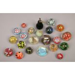 A collection of glass paperweights to include spilt cane examples.