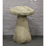 A reproduction decorative cast concrete staddle stone.