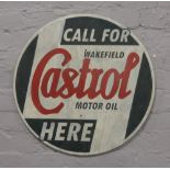 A painted circular steel reproduction advertising sign for Castrol Motor Oil.