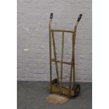 A tubular metal sack barrow.