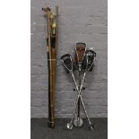 Seven walking sticks to include antler handle, dogs head and miners yard stick, along with three