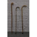 Three walking sticks to include silver mounted example.