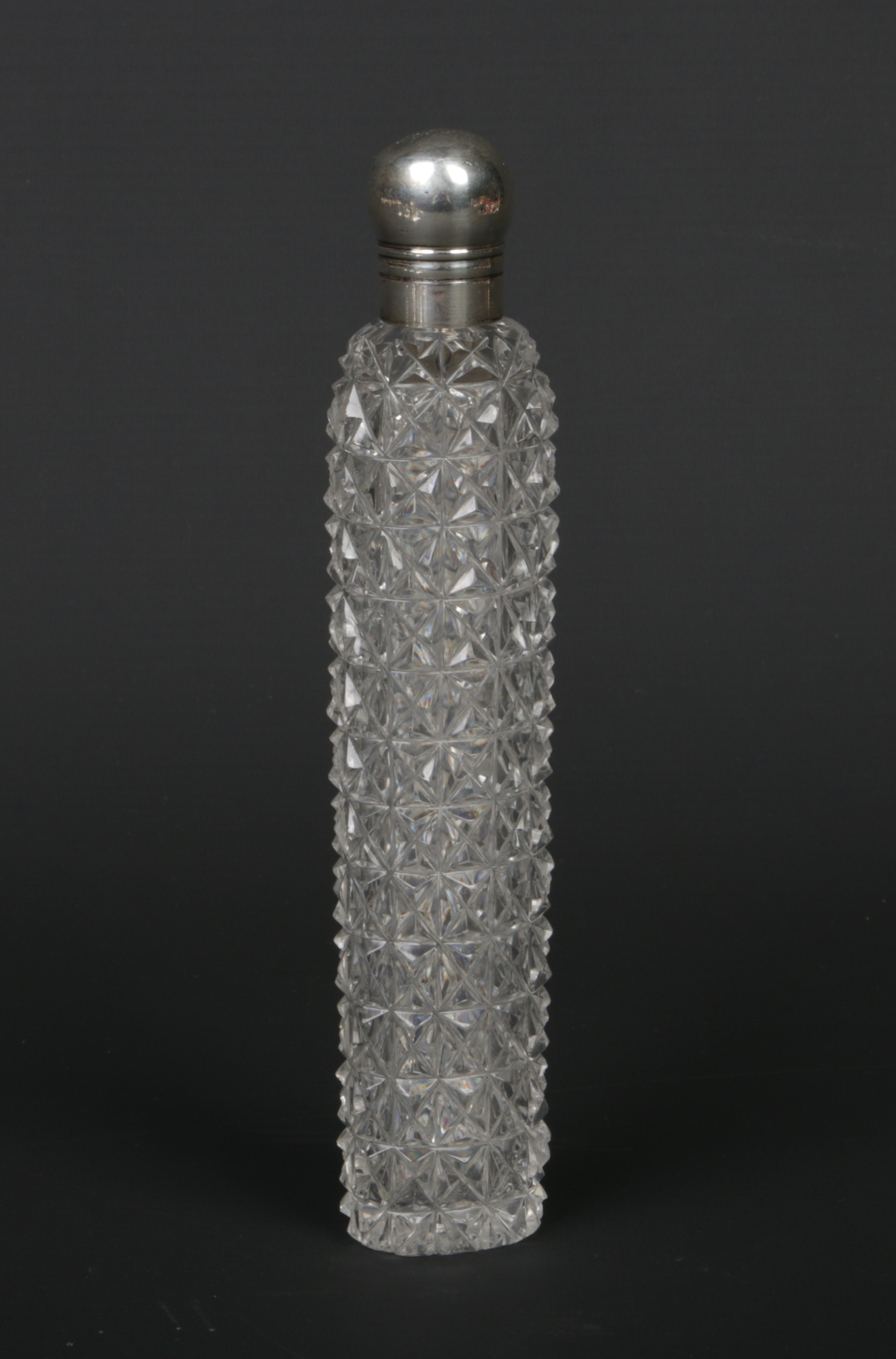 A Victorian cut glass scent bottle with silver top. Assayed Birmingham 1889, 18cm.Condition report