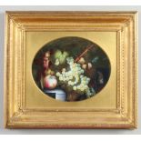 A 19th century gilt framed porcelain plaque. Finely enamelled with a still life fruit study with a