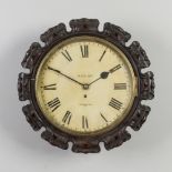 A Victorian mahogany cased single fusee wall clock. With carved piecrust bezel and painted dial