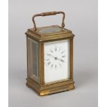 A late 19th century French brass carriage clock. With enamel dial having Roman numeral markers in