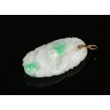 A Chinese white jade pendant with spinach green suffusion and 14 carat gold clasp. Finely carved