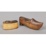 An 18th century horn snuff box with steel loop handle along with a novelty snuff box formed as a