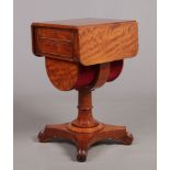 A 19th century satinwood centre pedestal two drawer work table. With drop leaves and raised on