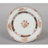 An 18th century Chinese export plate. Decorated in the Imari palette with flowers and pomegranates