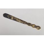 A Japanese bronze paper knife. Engraved with birds and flowers and having gilt embellishments, 22.