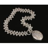 A Victorian silver ovoid locket on pierced collar. Assayed Birmingham 1883, 52.46 grams.Condition