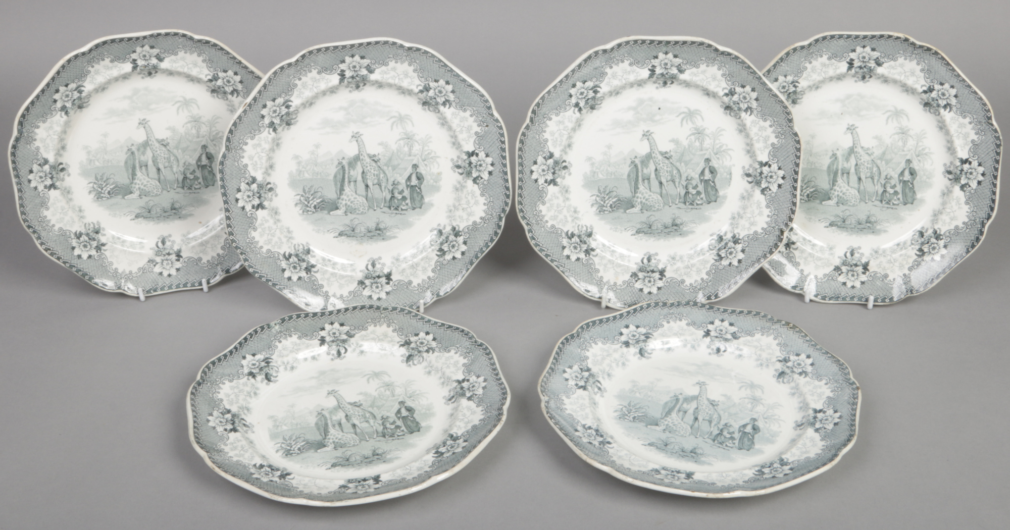 Six John Ridgway dinner plates. Printed in green with the Giraffe pattern, depicting three