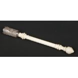 A posy holder. With carved ivory grip and white silver filigree top, 20.5cm.Condition report