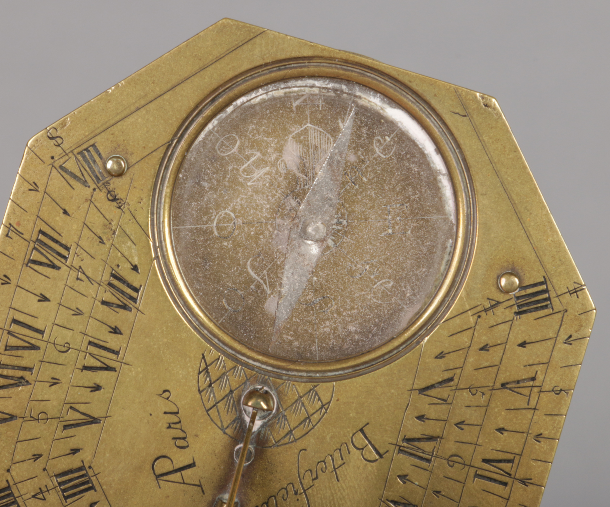 An 18th century brass Butterfield pocket sundial compass. With folding gnomon ornamented with a pair - Image 3 of 4