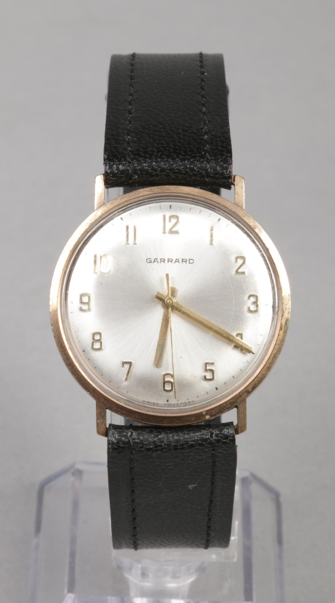 A Garrard 9 carat gold cased presentation manual wristwatch. With satin dial and applied Arabic