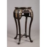 An early 20th century large Chinese carved hardwood and marble top jardiniere stand. Inlaid with