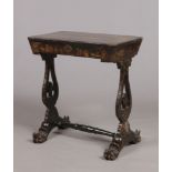 A mid 19th century Japanned work table. With fitted interior and raised on twin lyre supports