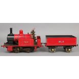 A 3.5" gauge 0-4-0 live steam tank engine and tender.  With red livery, the engine named Tich and