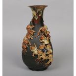 A Japanese Sumida Gawa square baluster shaped vase. With drip glazed neck and applied with two