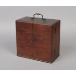 An early 19th century mahogany travelling medicine chest or apothecary cabinet. With bronze handle