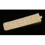 A 19th century Cantonese carved ivory cribbage board. Housing pegs contained behind a threaded