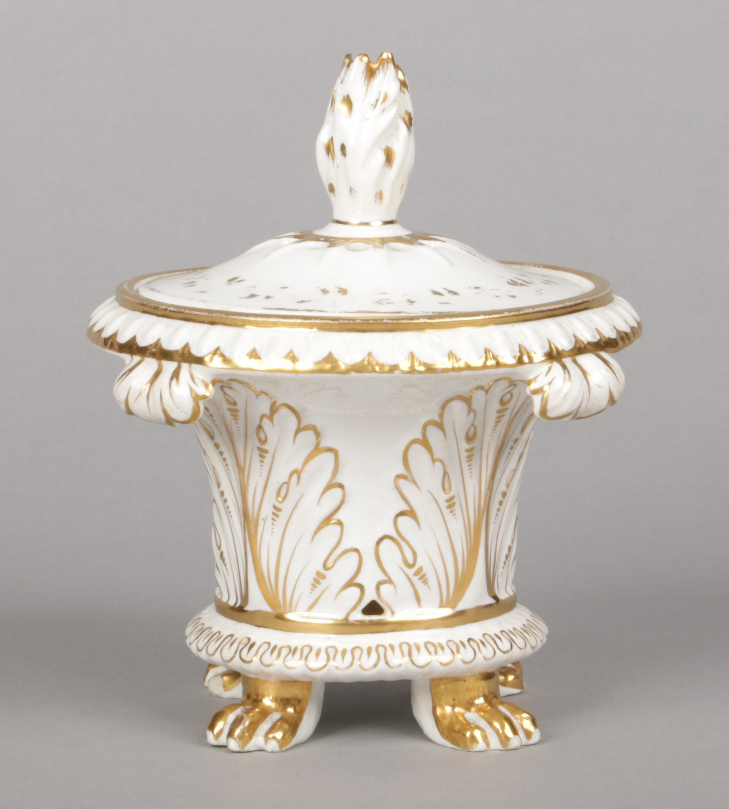 A rare Rockingham pastille burner and cover of Neo-Classical style with simple gilt decoration.