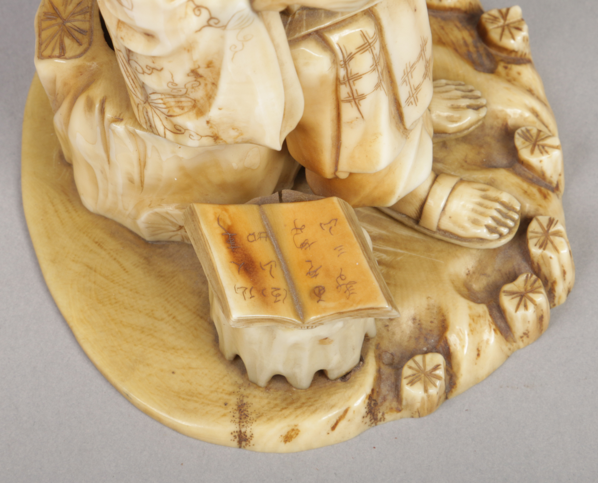 A Japanese Meiji period carved ivory okimono. Formed as a seated sage. Signed with a lacquer - Image 3 of 6