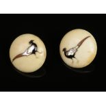 A pair of Japanese Meiji period ivory earrings. With Shibayama inlay depicting peasants, 24mm