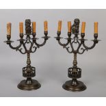 A pair of Dutch 18th century style bronze armorial four branch candelabra / tablelamps. Each with