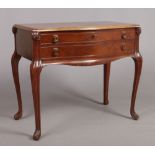 A mahogany two drawer canteen table raised on reeded cabriole supports. Housing a 12 place silver